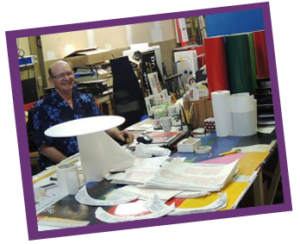 city sign shop with supplies and artworks in progress